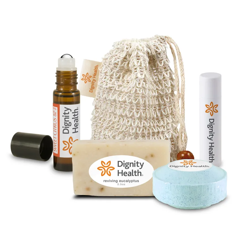 Loofah Bag with Roll-on Oil, Mini Soap, Shower Steamer, and Lip Balm with Sewn-in Tag